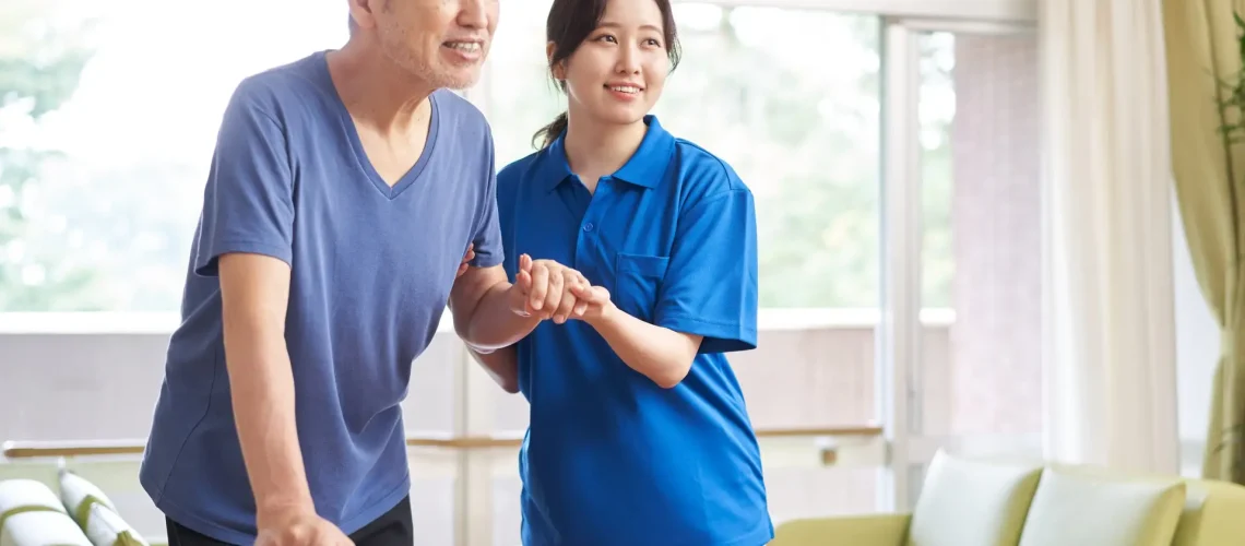 A caregiver who assists the elderly in walking Live In Care